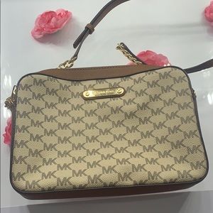 Barley used Micheal Kors cross body!